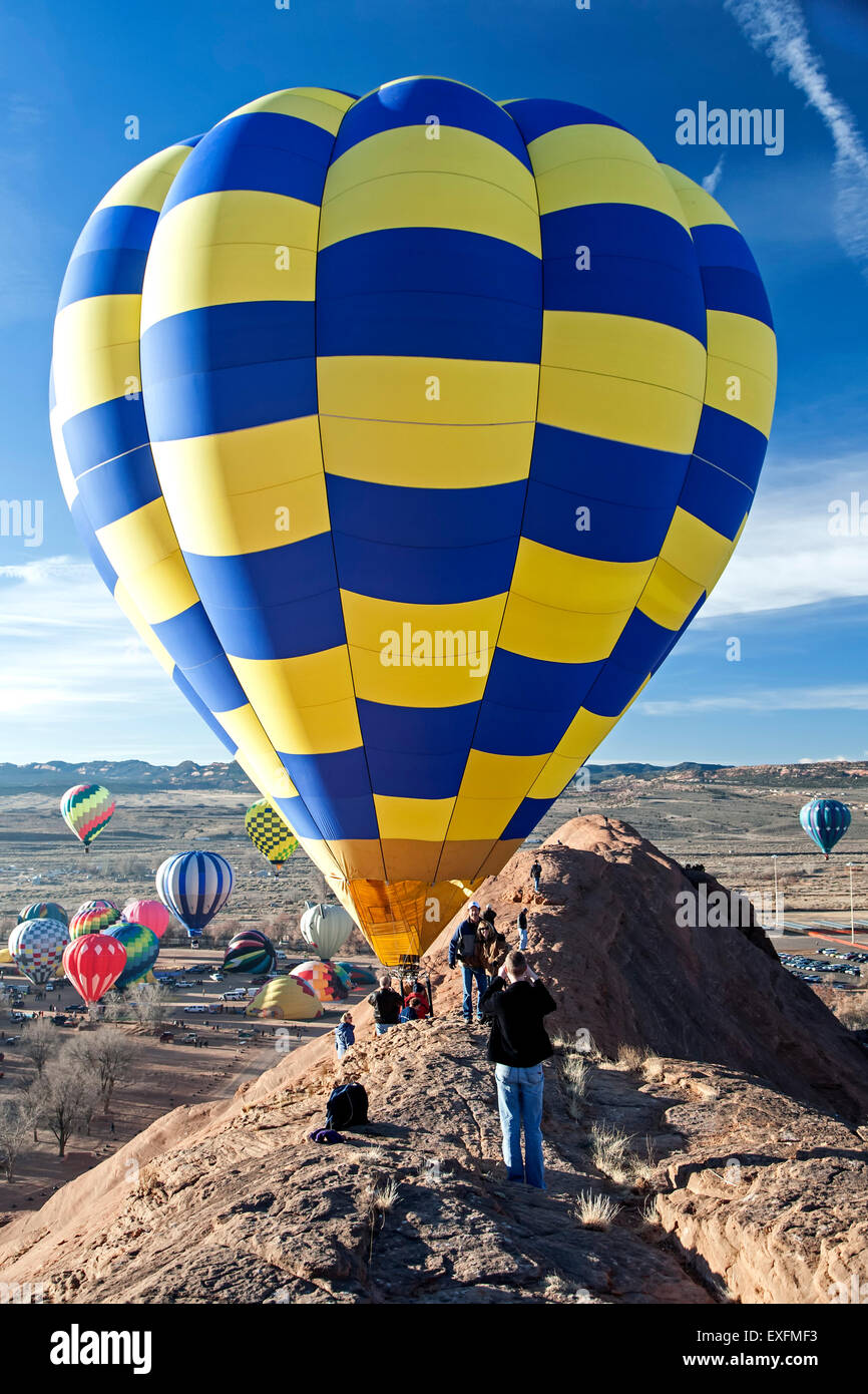 People on ridge and hot air balloons, Mass Ascension, Red Rock Balloon