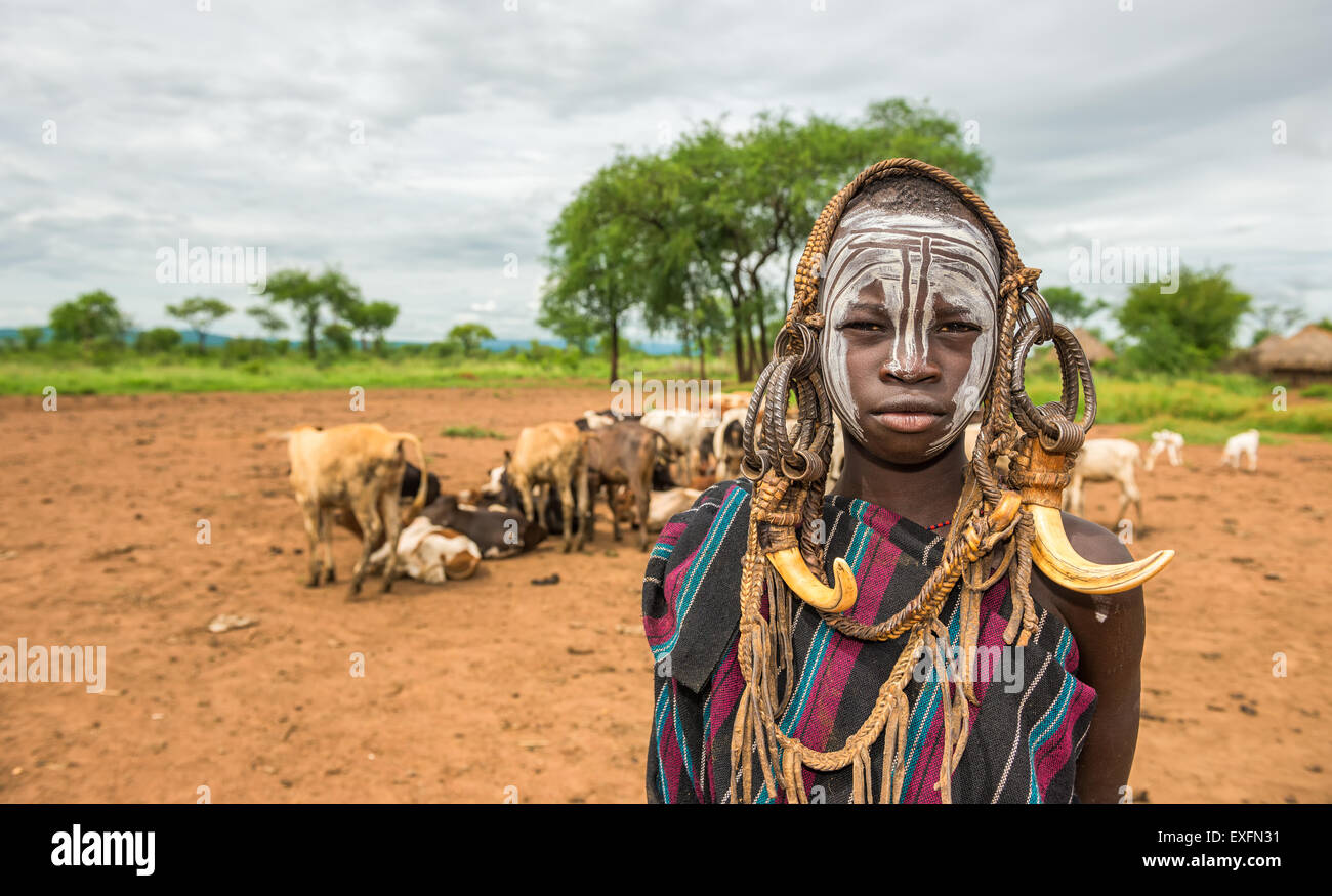 Young boy from the African tribe Mursi with traditional horns in Mago National Park, Ethiopia Stock Photo