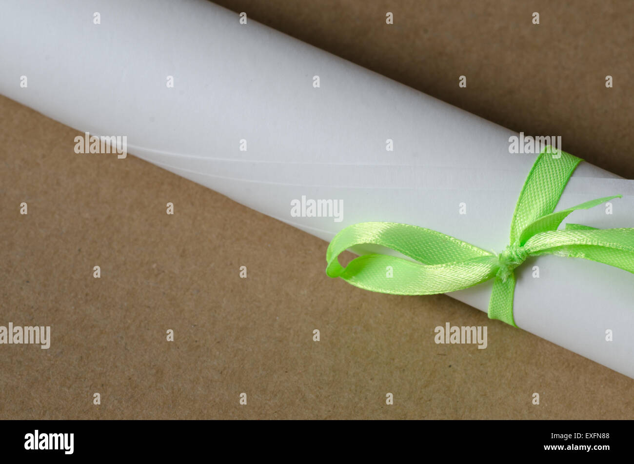 paper roll with green ribbon Stock Photo