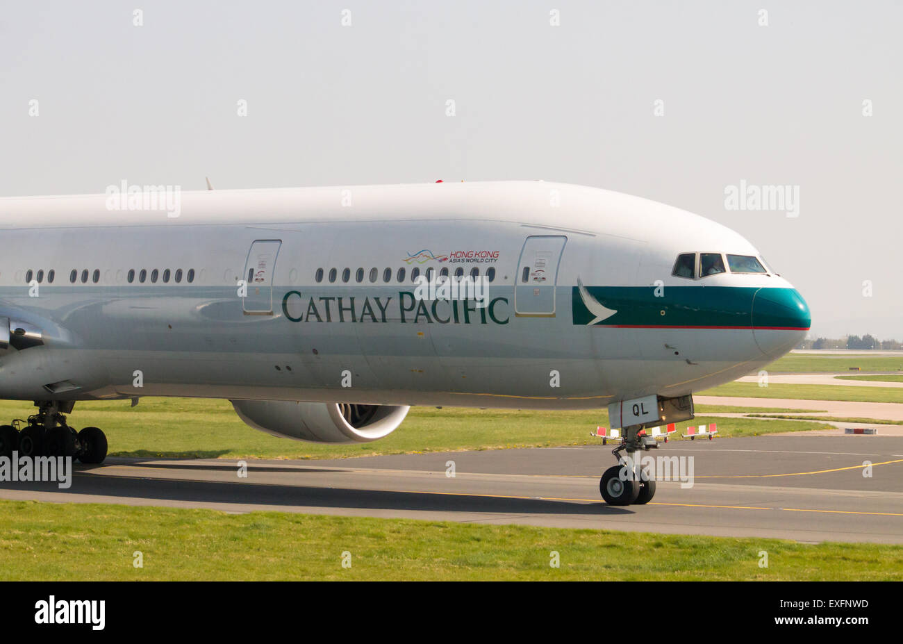 Cathay Pacific Boeing 777 taxiing on Manchester Airport taxiway. Stock Photo