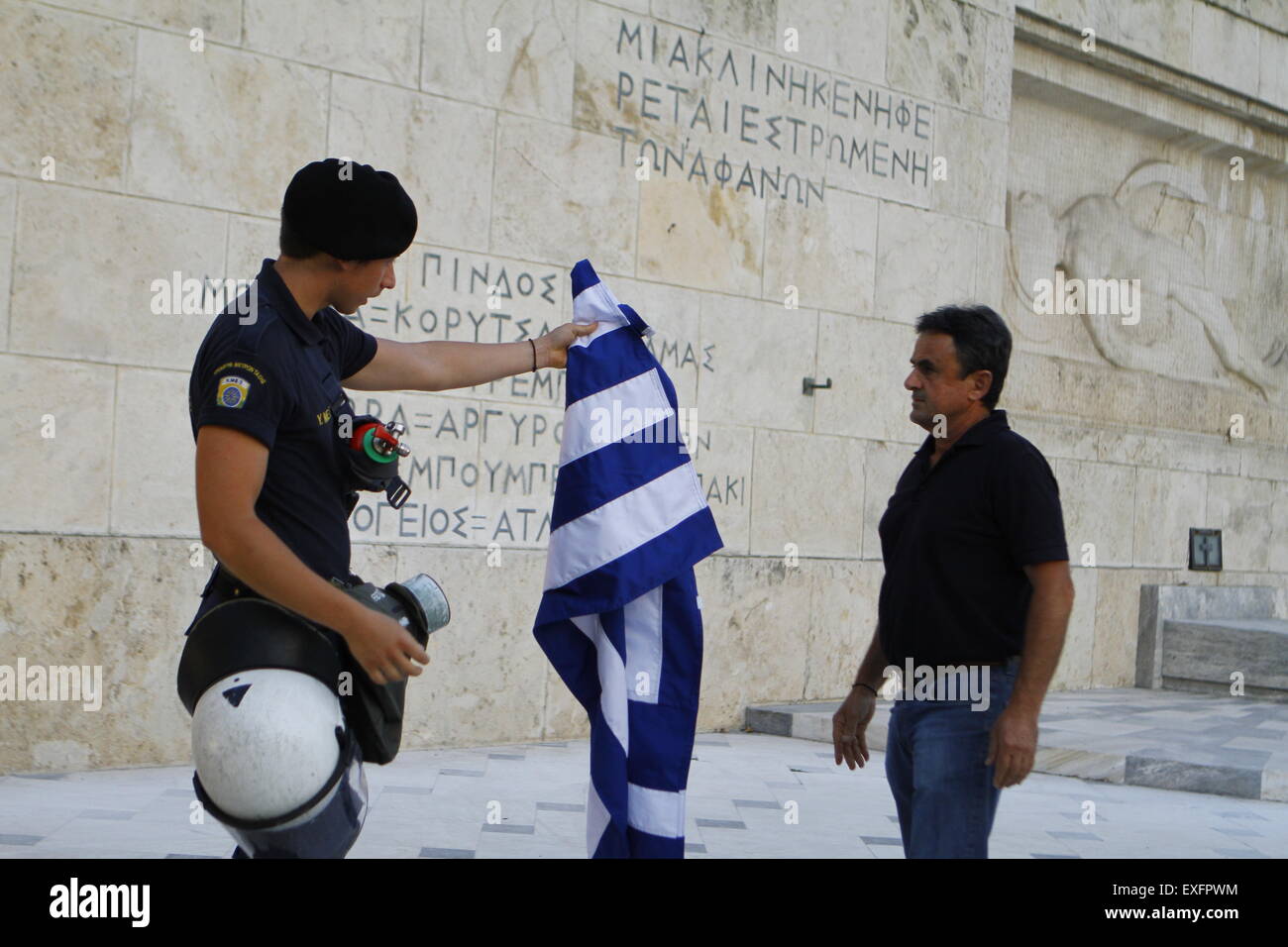 Athens, Greece. 13th July, 2015. A riot police officer returns the ...