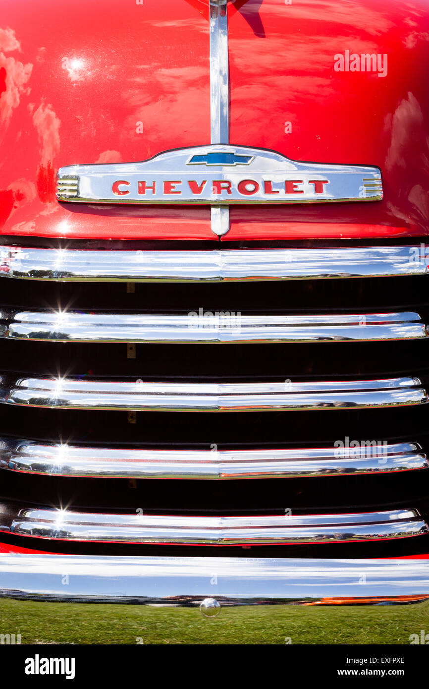 Classic American car fender grille front of vehicle close up Stock