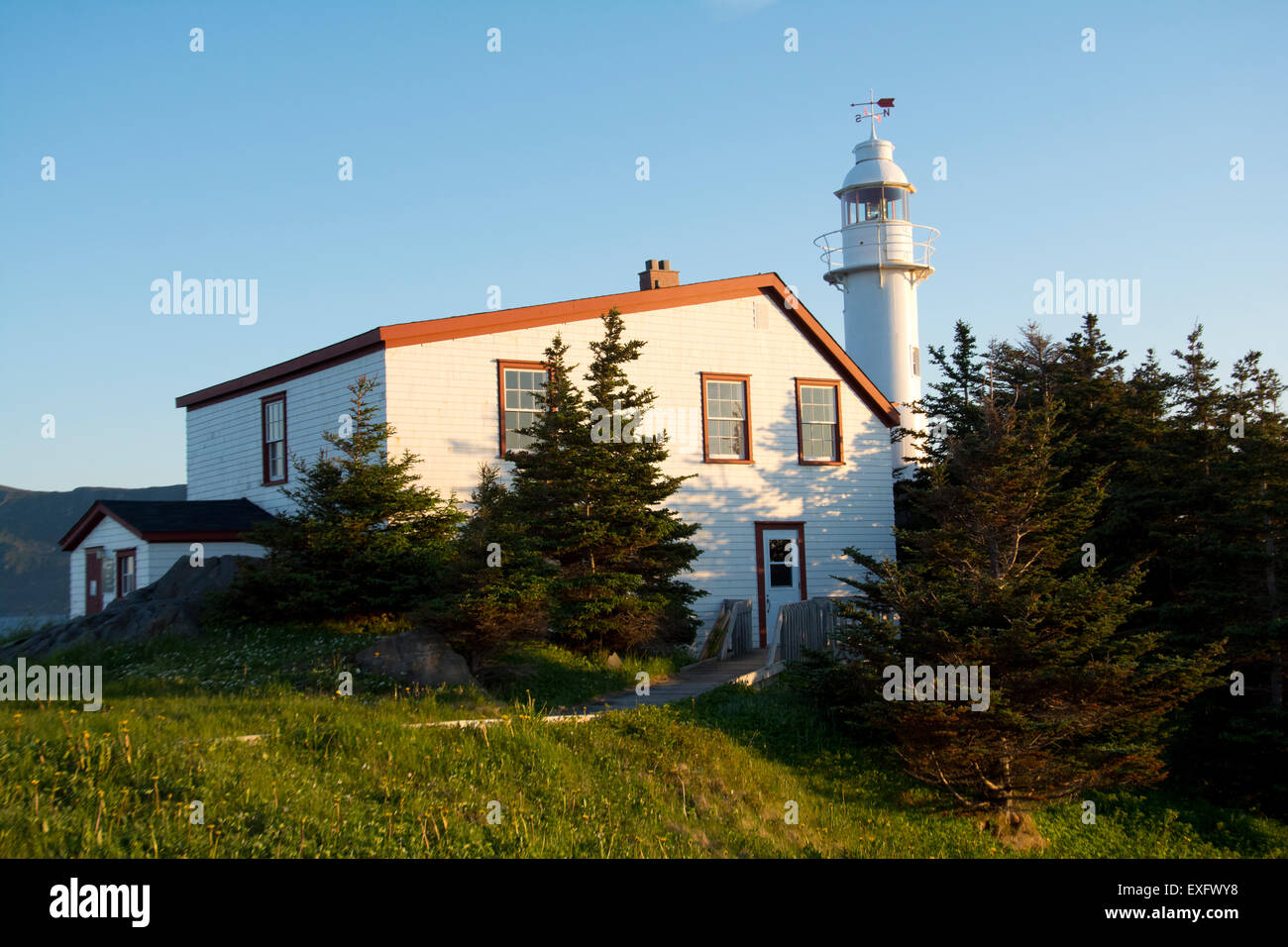 The Lobster Cove Head Lighthouse at sunset, Newfoundland Stock Photo