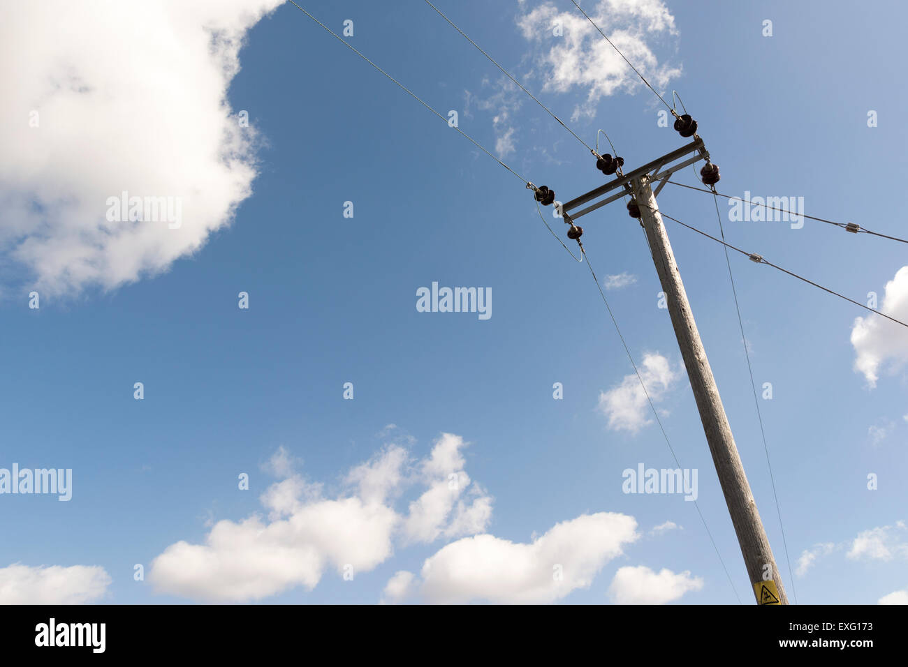 Power line against blue sky and sun power lines hi-res stock ...