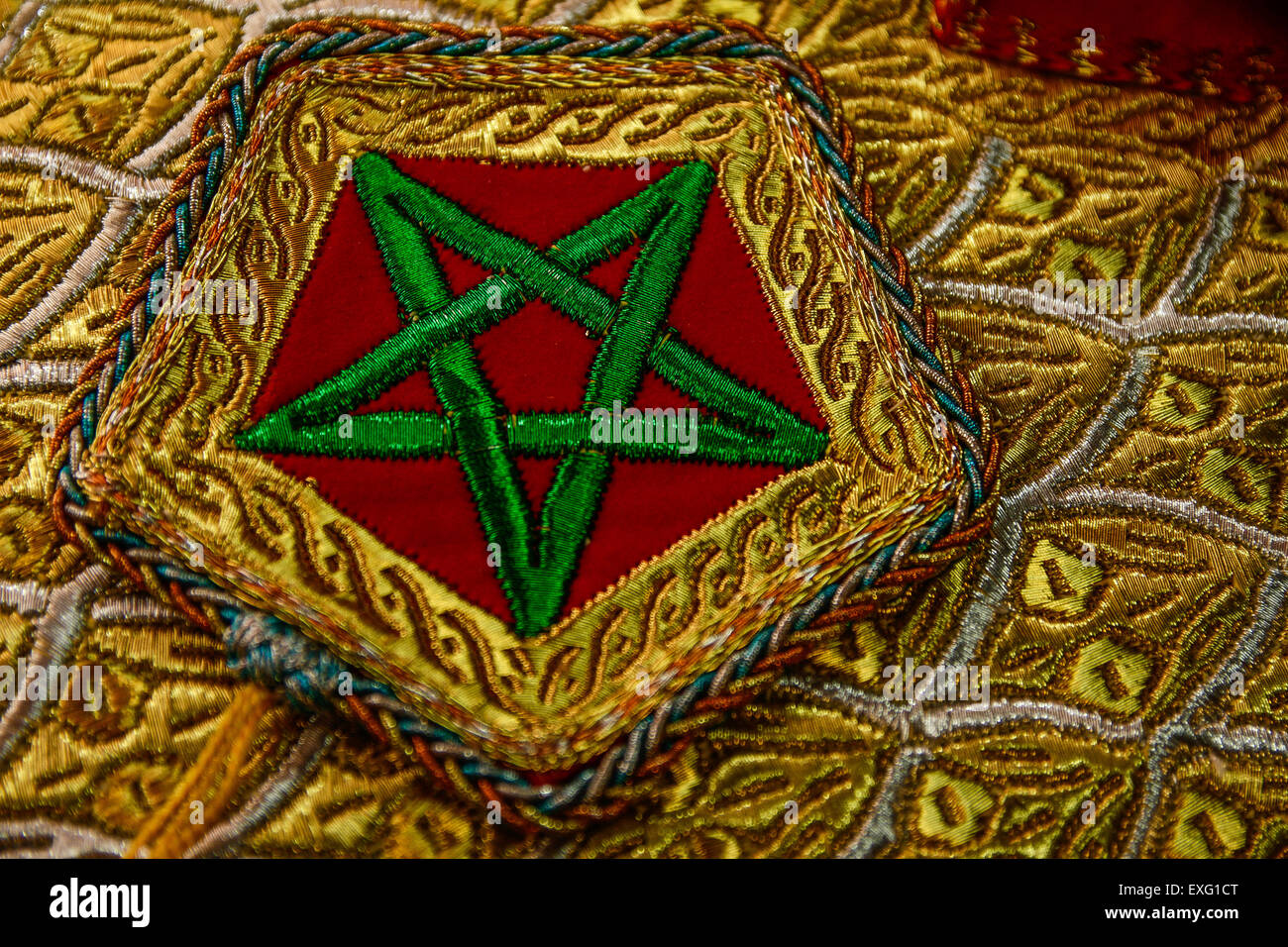 Moroccan Flag Embroidery in Red and Green with Intricate Gold Thread Designs Stock Photo