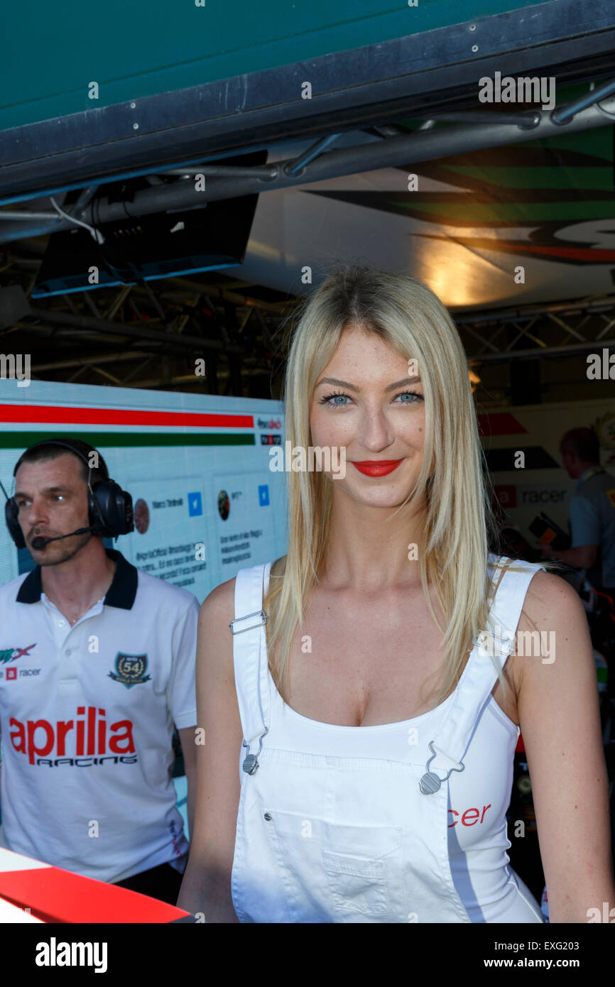 MISANO ADRIATICO, ITALY - JUNE 21, 2015: A grid girls pose for fans during the pit walk during SUPERBIKE Race Stock Photo