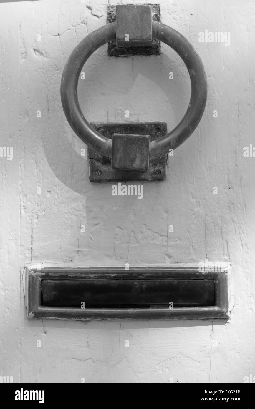 Heavy iron door knocker and letterbox Stock Photo Alamy