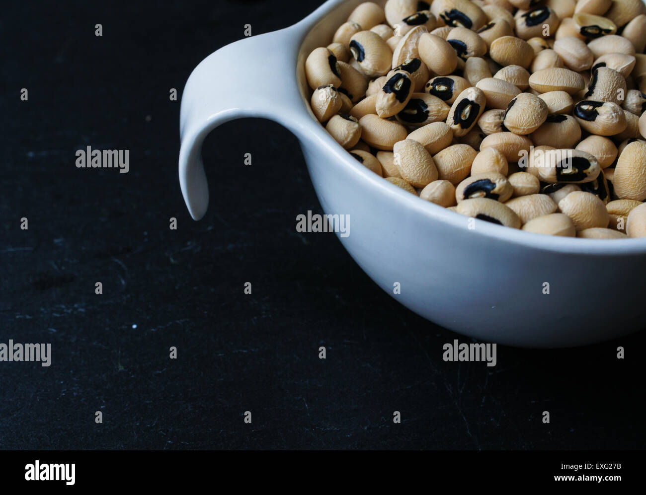 Dried blackeyed beans on the black stone background Stock Photo Alamy