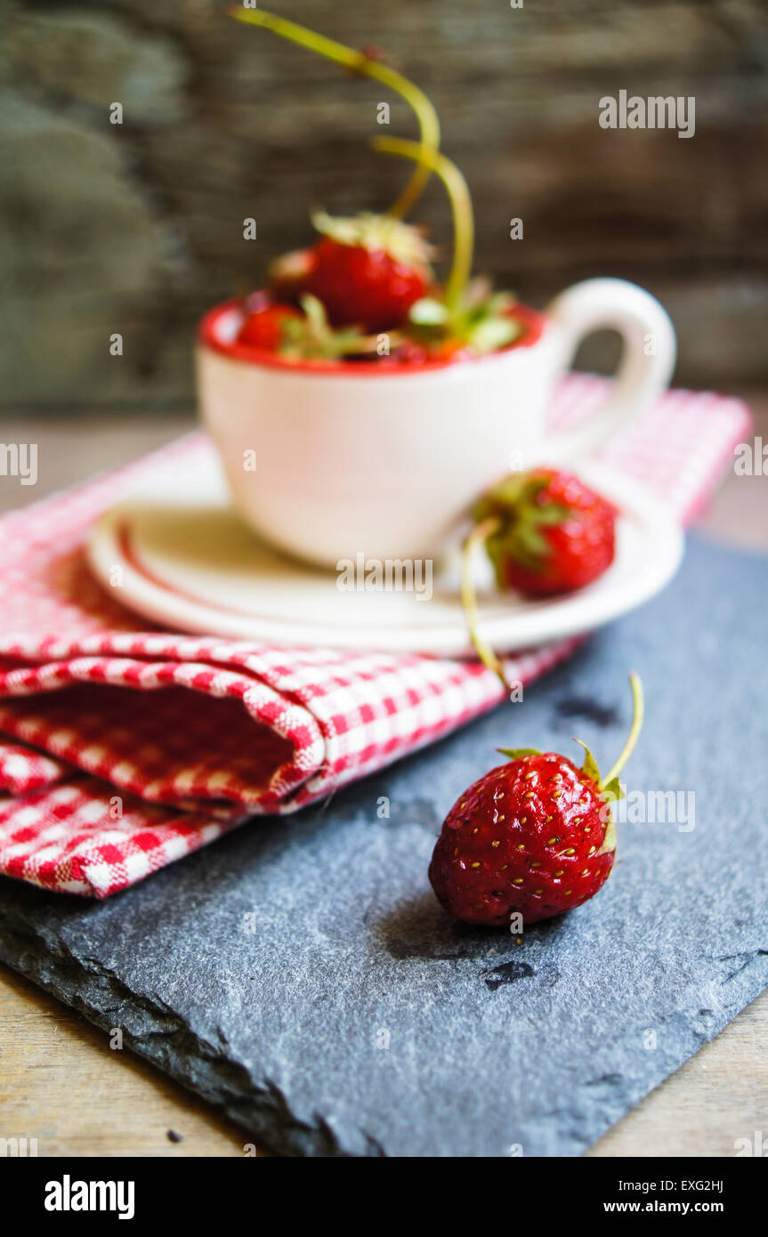 Fresh strawberries on the old wooden background Stock Photo - Alamy