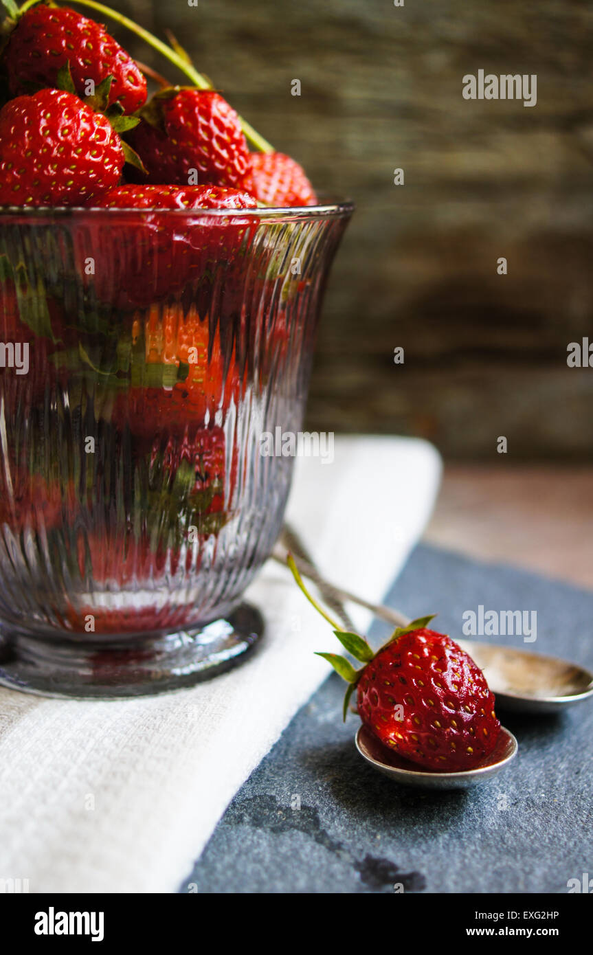 Fresh strawberries on the old wooden background Stock Photo - Alamy