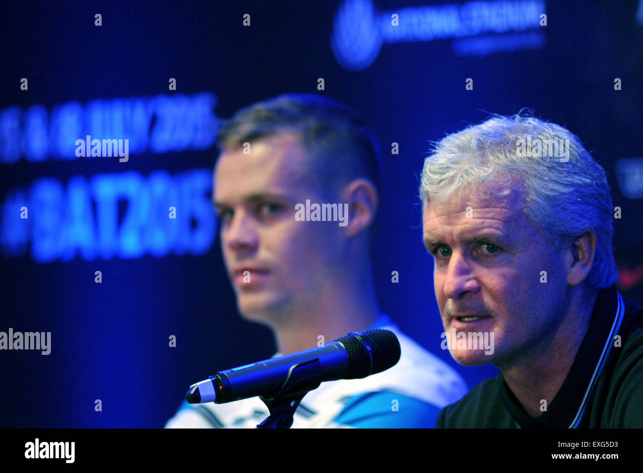 Singapore. 14th July, 2015. Stoke City's coach Mark Hughes (R) and team