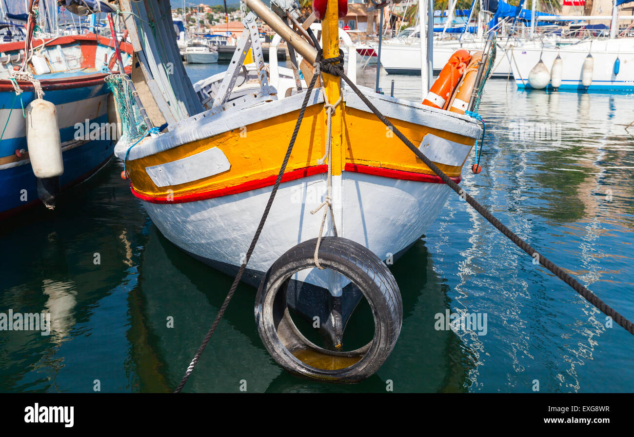 Small colorful wooden fishing boat moored in Propriano town, Corsica, France Stock Photo
