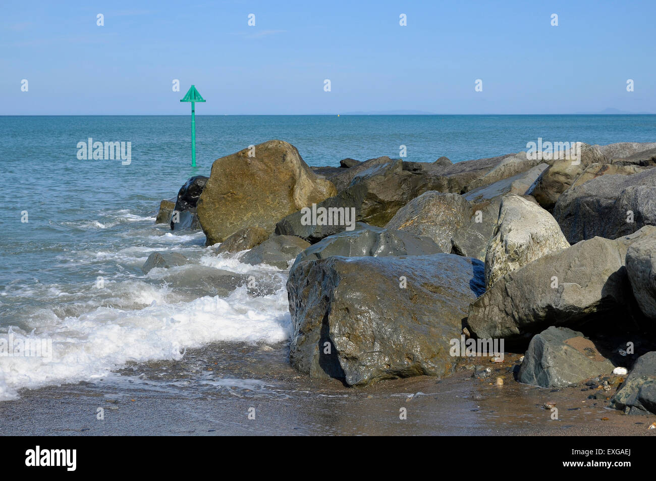 Rock armour (boulder barrier) groyne - part of recent coastal defence works at Tywyn on the coast of Gwynedd, Wales. Stock Photo