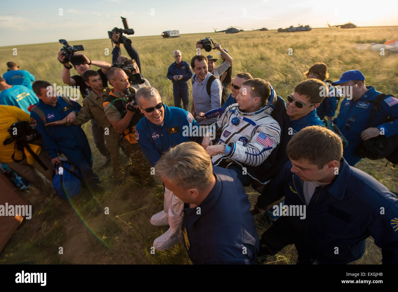 Expedition 43 commander Terry Virts of NASA is carried from all terrain vehicle (ATV) into a medical tent shortly after he and cosmonaut Anton Shkaplerov of the Russian Federal Space Agency (Roscosmos), center, and Italian astronaut Samantha Cristoforetti from European Space Agency (ESA) landed in a remote area near the town of Zhezkazgan, Kazakhstan on Thursday, June 11, 2015. Virts, Shkaplerov, and Cristoforetti are returning after more than six months onboard the International Space Station where they served as members of the Expedition 42 and 43 crews. Stock Photo