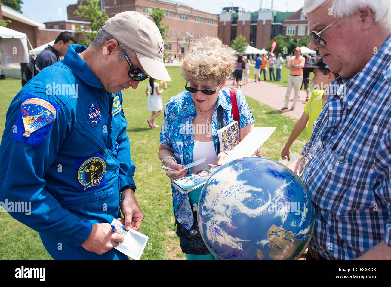 NASA astronaut Steve Swanson, left, signs autographs during the TouchTomorrow Festival, held in conjunction with the 2015 Sample Return Robot Challenge, Saturday, June 13, 2015 at the Worcester Polytechnic Institute (WPI) in Worcester, Mass.  Sixteen teams competed for a $1.5 million NASA prize purse. Teams will be required to demonstrate autonomous robots that can locate and collect samples from a wide and varied terrain, operating without human control. The objective of this NASA-WPI Centennial Challenge is to encourage innovations in autonomous navigation and robotics technologies. Innovati Stock Photo