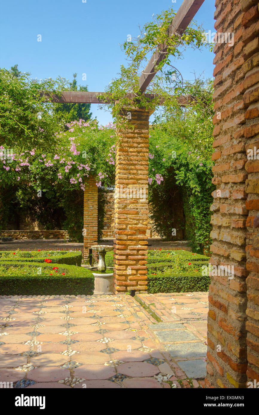 Courtyards and gardens of the famous Palace of the Alcazaba in Malaga Spain Stock Photo