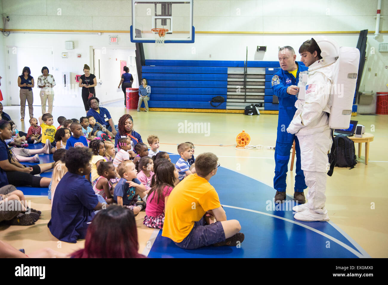 Astronaut Barry &quot;Butch&quot; Wilmore describes the functions of a space suit to students attending the Joint Base Anacostia-Bolling (JBAB) Summer Camp June 24, 2015 at JBAB in Washington, DC. Stock Photo
