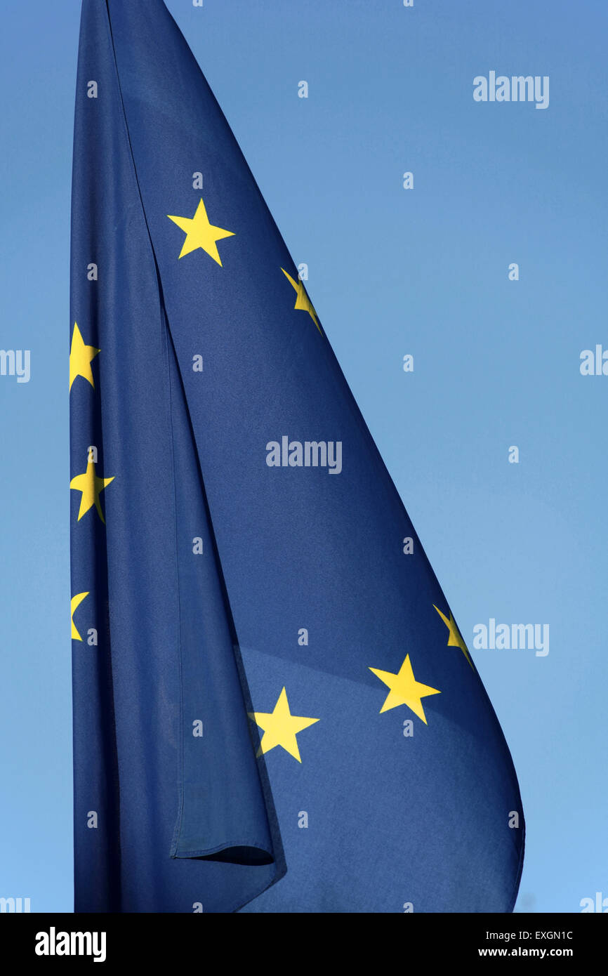 The EU flag against blue sky Stock Photo