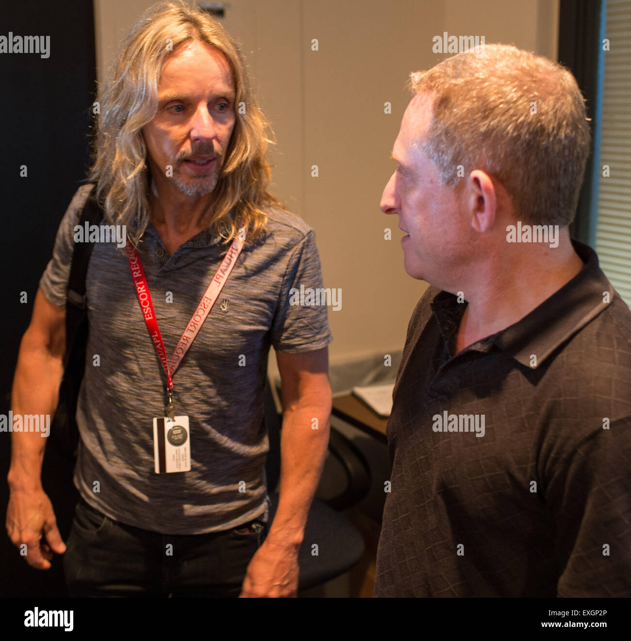 Tommy Shaw of the band Styx, left, meets with Alan Stern, New Horizons principal investigator, Wednesday, July 1, 2015 at The Johns Hopkins University Applied Physics Laboratory in Laurel, Md.  Members of the band Styx visited with New Horizons team members and Mark Showalter, who discovered Pluto's fifth moon, Styx, in July of 2012. Stock Photo