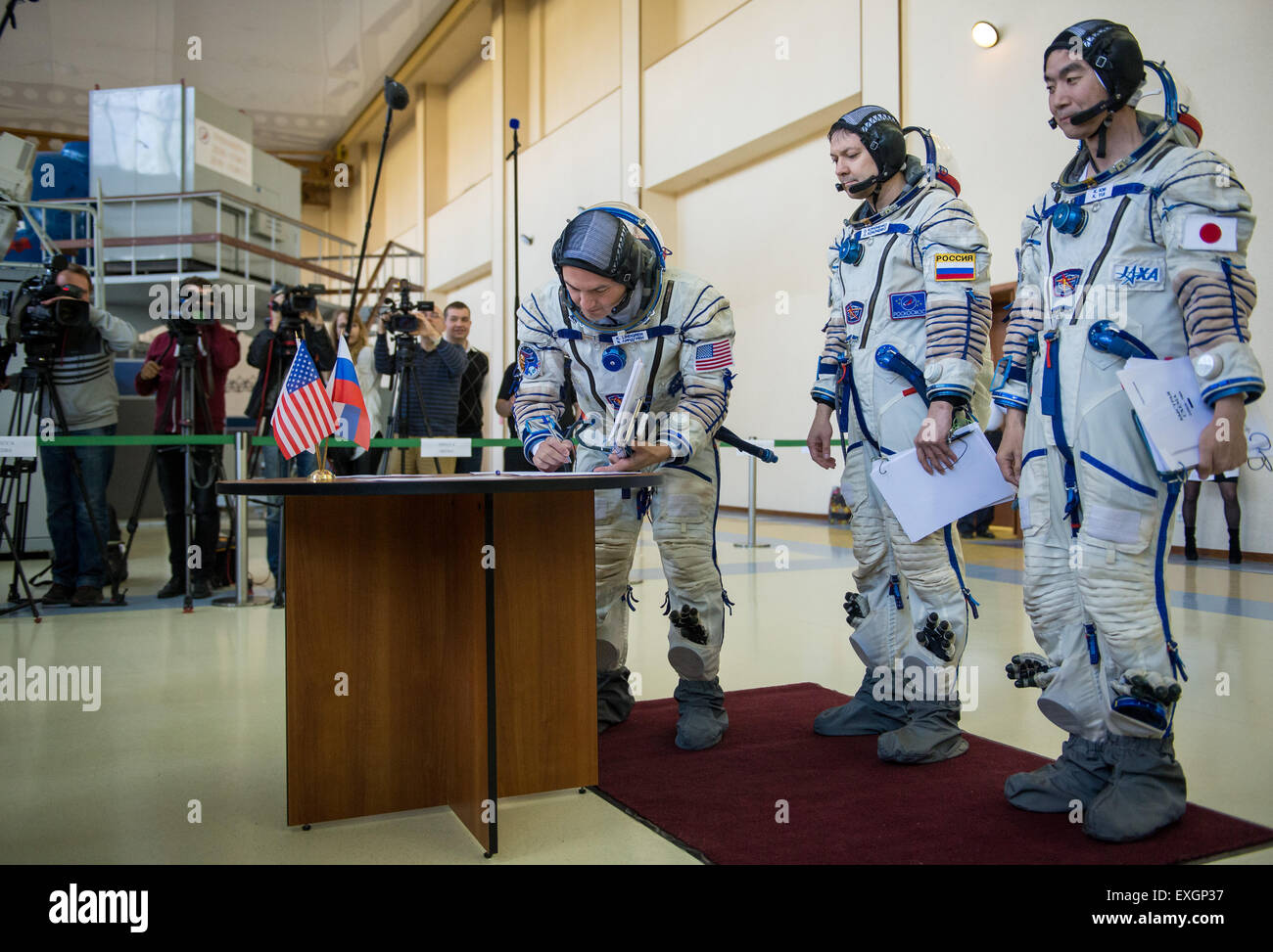 NASA astronaut Kjell Lindgren, left, Russian cosmonaut Oleg Kononenko, center, and Japan Aerospace Exploration Agency astronaut Kimiya Yui participate in the second day of qualification exams, Thursday, May 7, 2015 at the Gagarin Cosmonaut Training Center (GCTC) in Star City, Russia. The Expedition 44/45 trio is preparing for launch to the International Space Station in their Soyuz TMA-17M spacecraft from the Baikonur Cosmodrome in Kazakhstan. Stock Photo