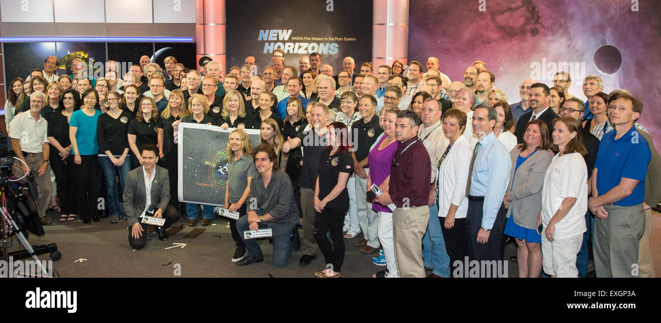 Tommy Shaw, Todd Sucherman and Lawrence Gowen of the band Styx pose for a picture with members of the New Horizons science team, Wednesday, July 1, 2015 at The Johns Hopkins University Applied Physics Laboratory in Laurel, Md.  Members of the band Styx visited with New Horizons team members and Mark Showalter, who discovered Pluto's fifth moon, Styx, in July of 2012. Stock Photo
