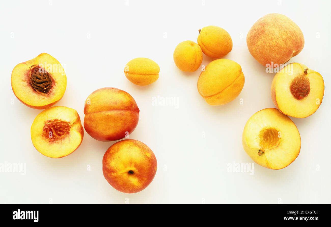 Three Nectarines, one cut in half Stock Photo Alamy