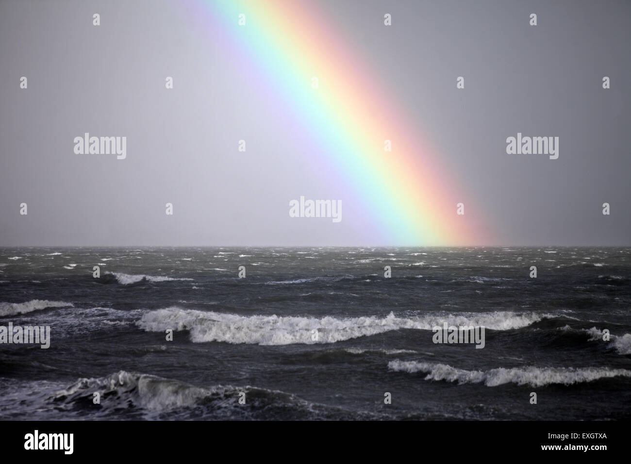 rainbow over stormy sea New Zealand Stock Photo - Alamy