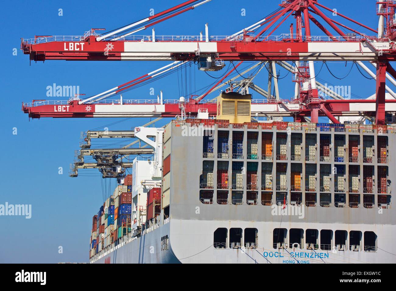 The Container Ship, OOCL Shenzhen, Loading And Unloading At The Long Beach Container Terminal, Los Angeles, California, USA. Stock Photo