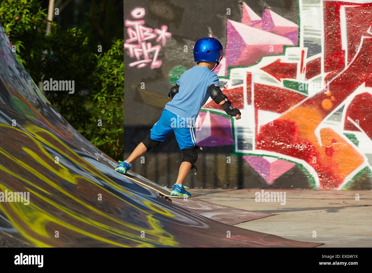 Young Boy Skateboarding in the SCAPE Skate Park, Singapore. Stock Photo