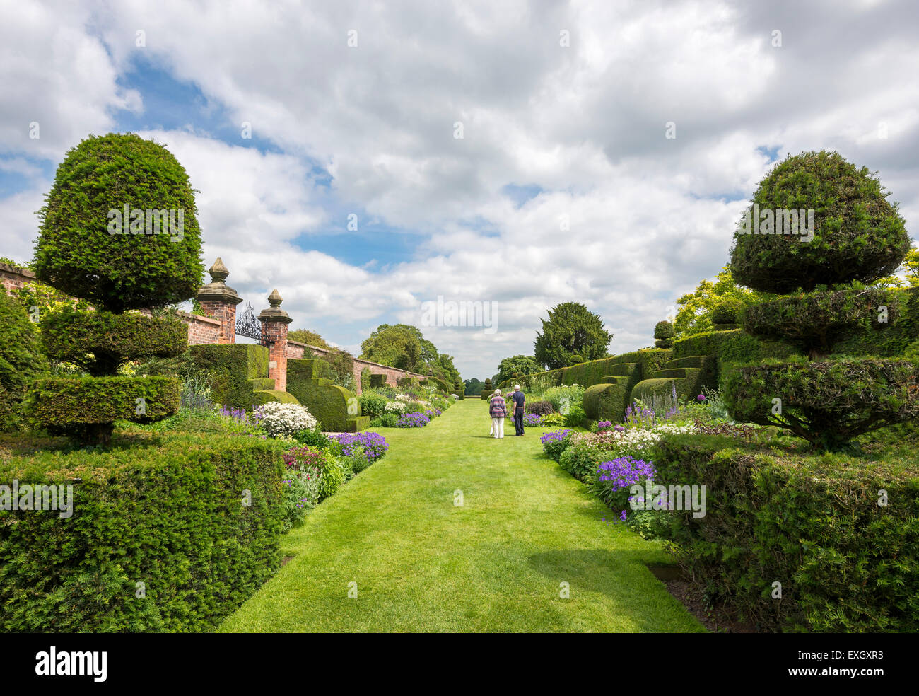 An elderly couple admiring the famous double herbaceous borders at Arley Hall in Cheshire, England. Stock Photo