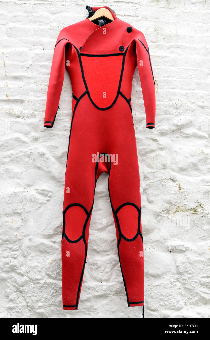 A red wet suit hanging out to dry in St Ives, Cornwall, England, U.K. Stock Photo
