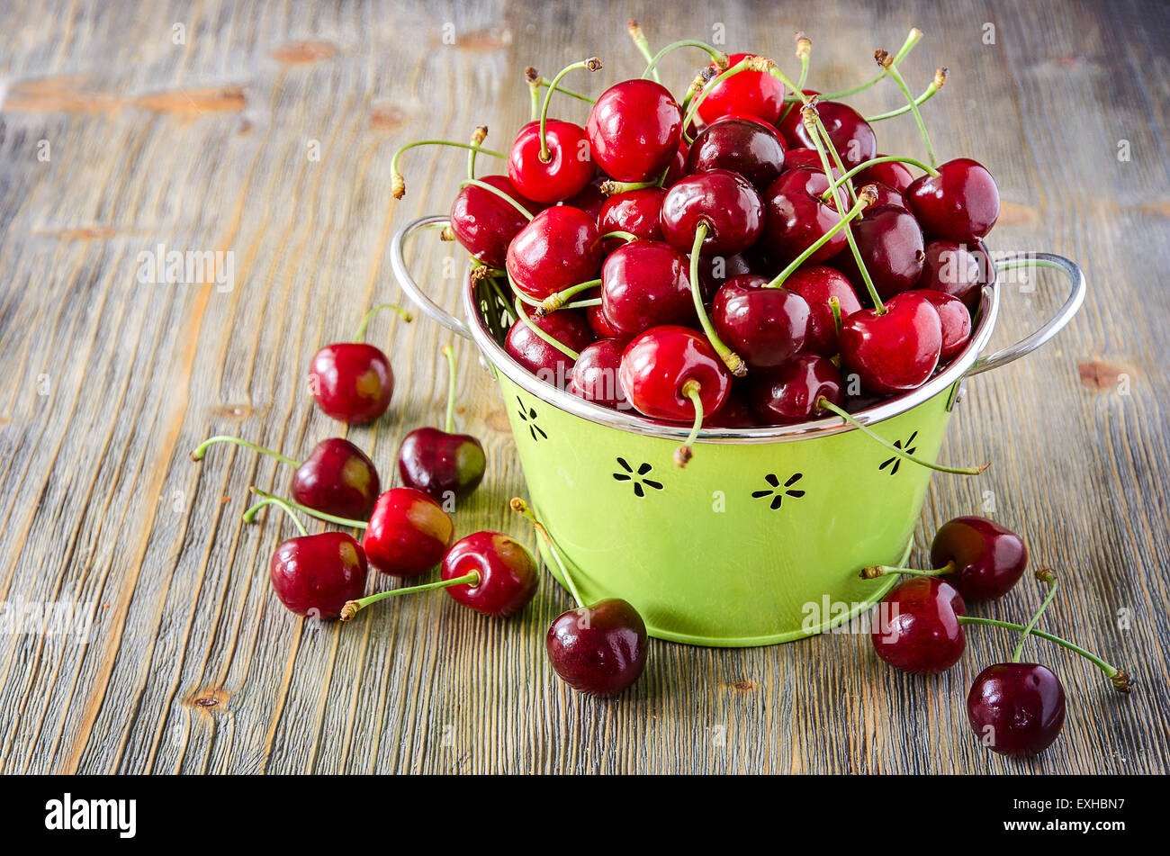 Sweet red ripe cherries in bowl, summer food, healthy berries Stock Photo