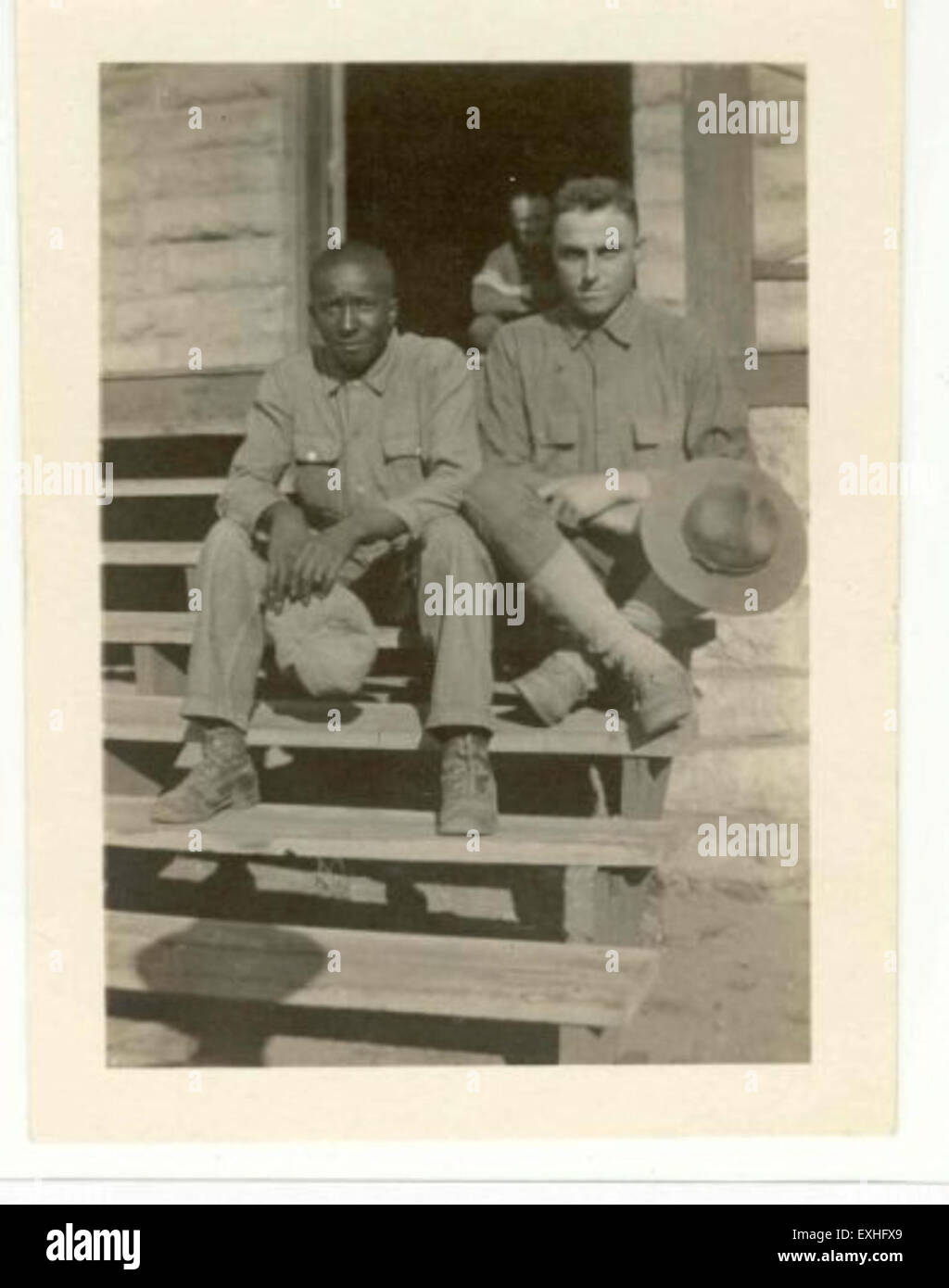 This photograph captures Louis Irvin and Chris Graber at Fort Riley, Kansas. The image highlights two military personnel as part of their service, emphasizing the military environment and activities at the base. Stock Photo
