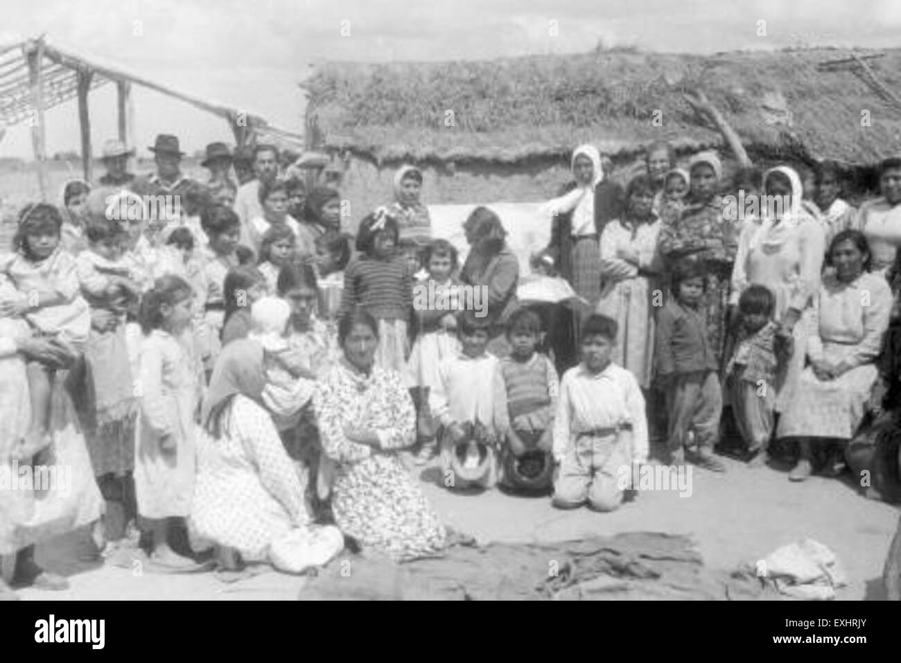 This photograph depicts a gathering of Toba women in Argentina. The image portrays a moment of cultural exchange or community interaction, reflecting the social dynamics and traditions of the Toba people in the Argentinean region. Stock Photo
