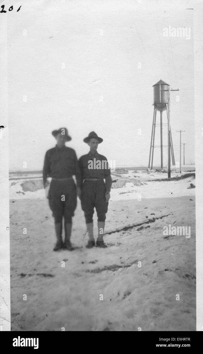The photograph 'Two Men in Uniform in the Snow' shows two soldiers ...
