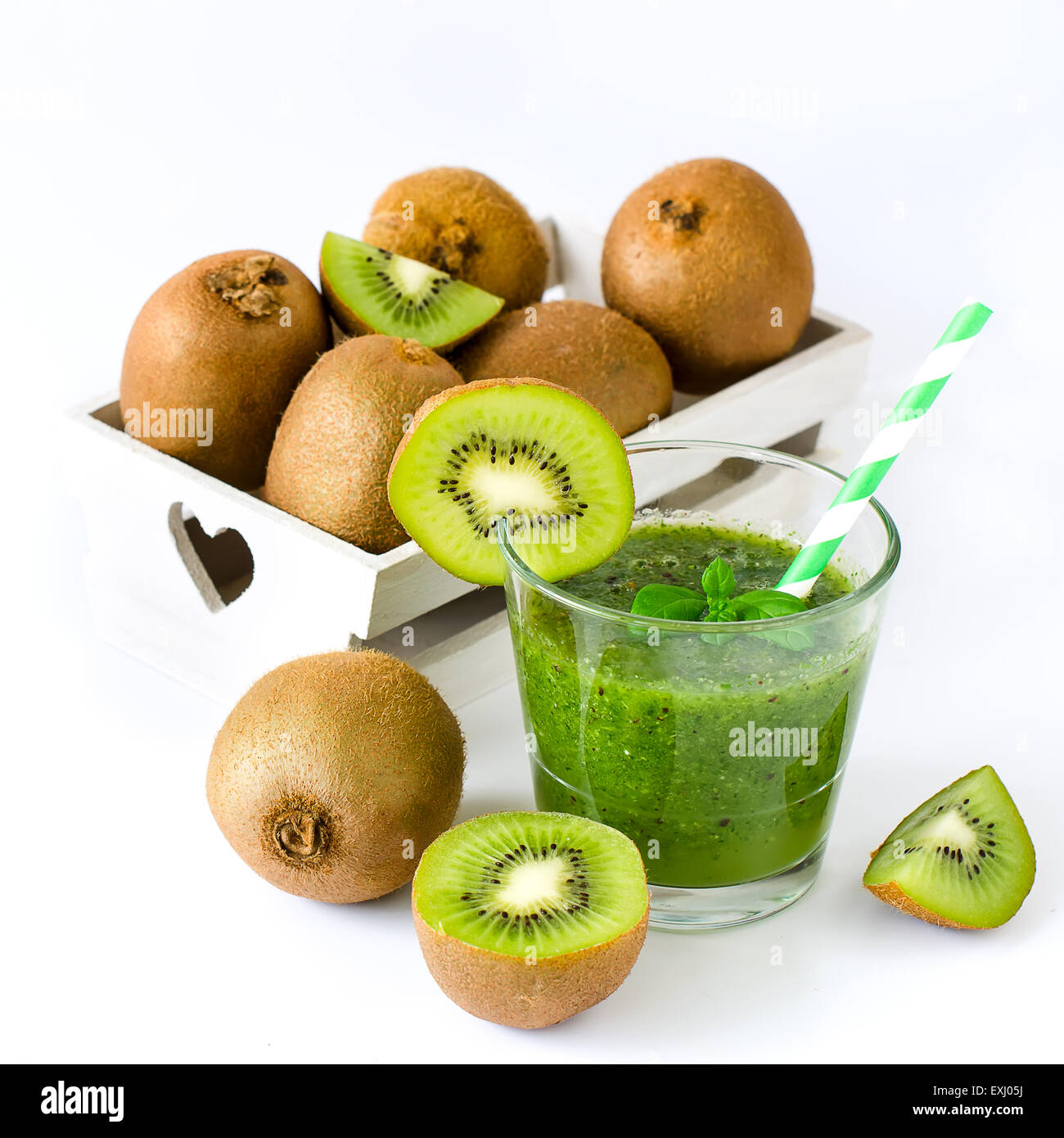 Green healthy kiwi tropical smoothie white background square image Stock Photo