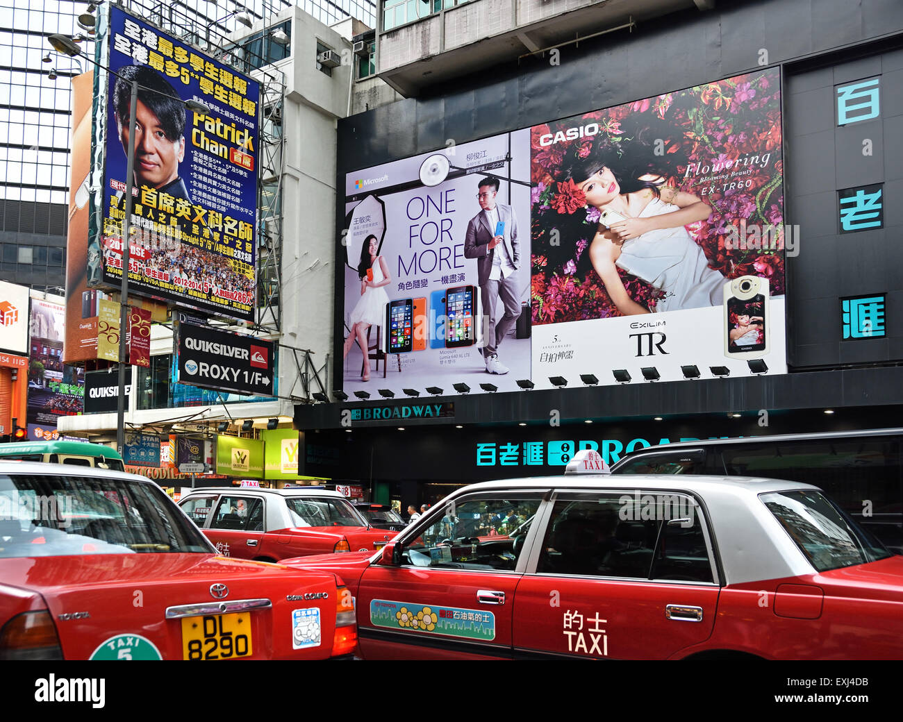 Busy street with advertising signs Mong Kok ( Nathan and Waterloo road Argyle Street district )  Kowloon Hong Kong China Stock Photo