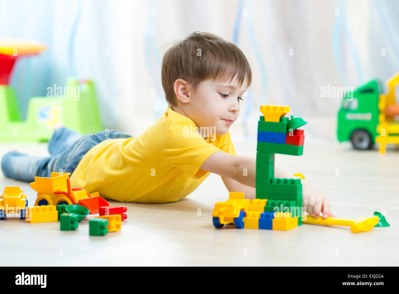 kid playing toy blocks at home Stock Photo