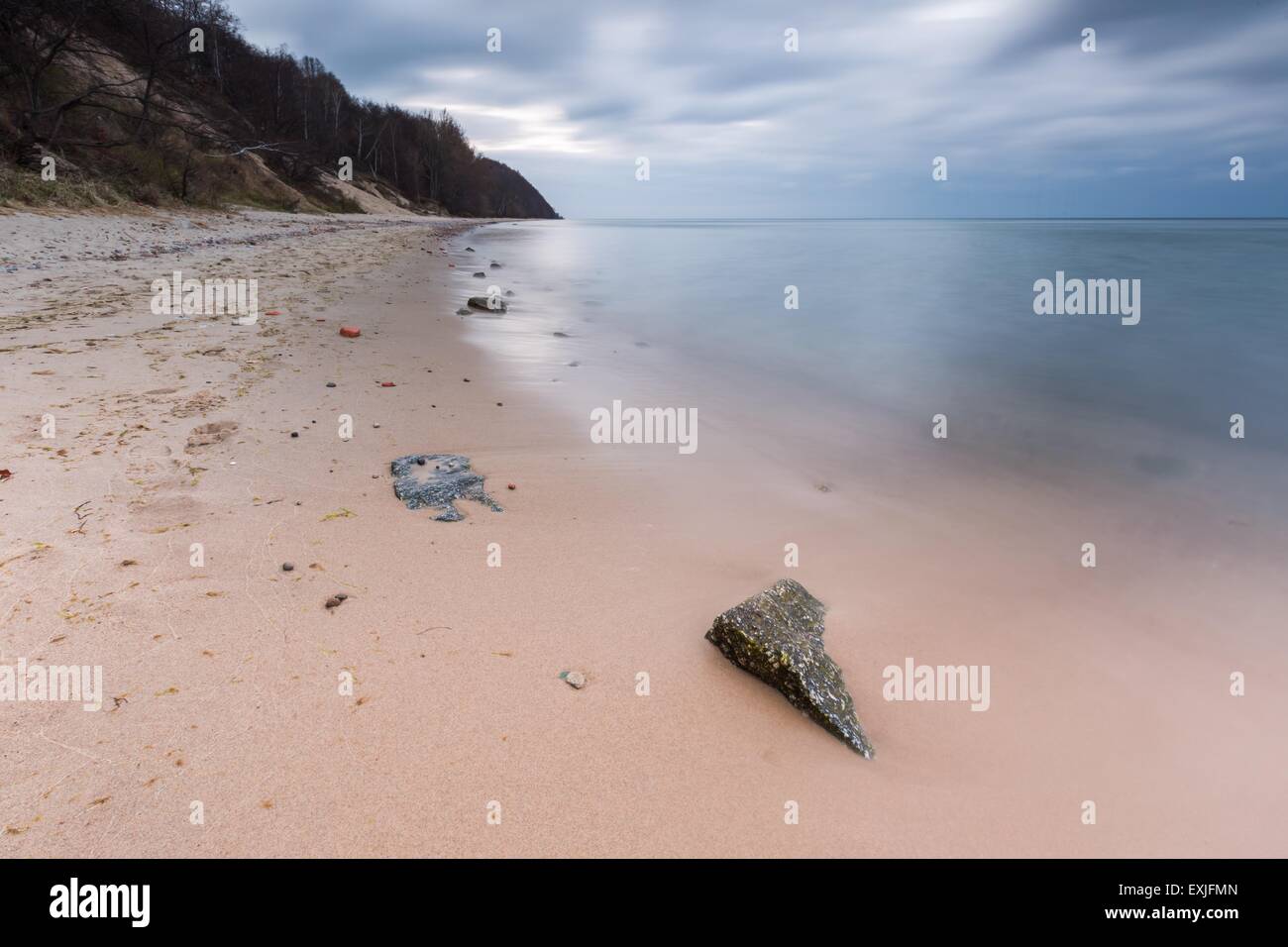 Beautiful long exposure landscape of rocky sea shore. Tranquil scene of ...