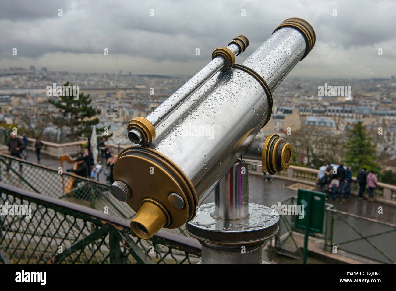 Telescope looking out over Paris from the Sacre Coeur. Stock Photo