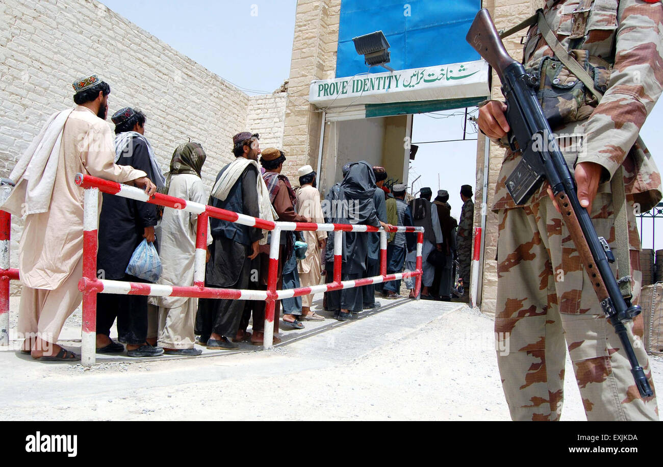 Pakistani security guard is stands alert when the Afghan prisoners are