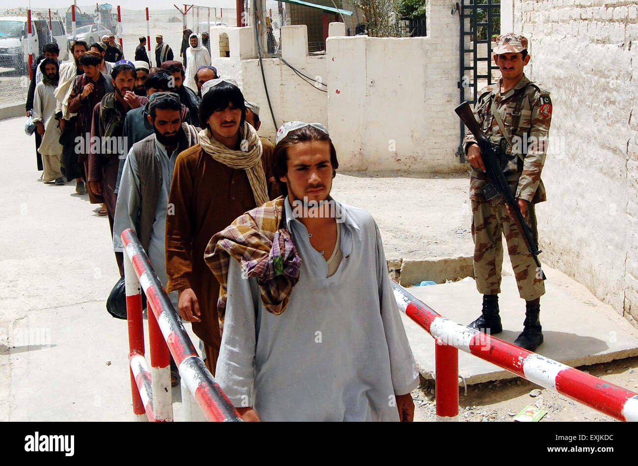Pakistani security guard is stands alert when the Afghan prisoners are