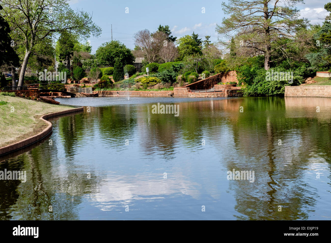 The pond and landscaping in Will Rogers park in Oklahoma City, Oklahoma, USA. Stock Photo