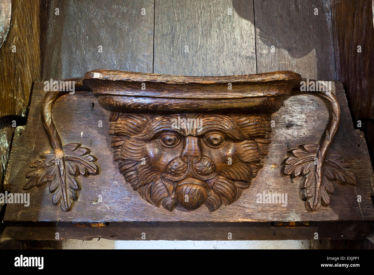 A misericord in St Michaels church in the Cotswold village of Duntisbourne Rouse, Gloucestershire UK Stock Photo