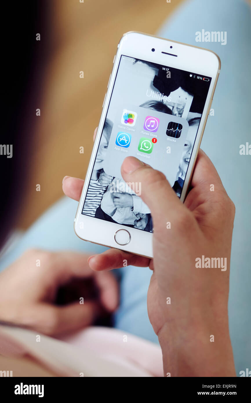 Person browsing through Apps on an iPhone Stock Photo