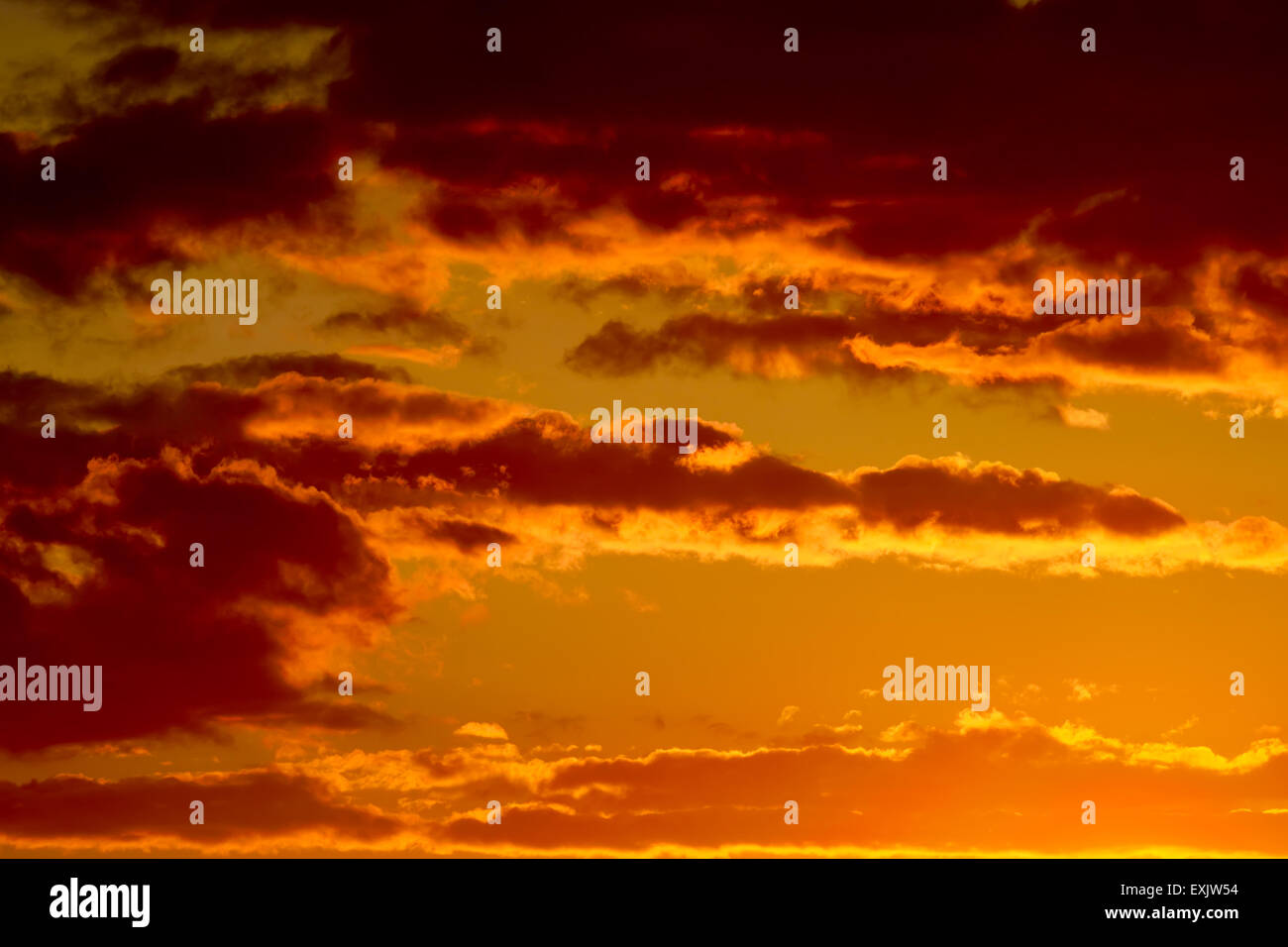 Heavenly landscape with dramatic crimson sunset clouds Stock Photo - Alamy