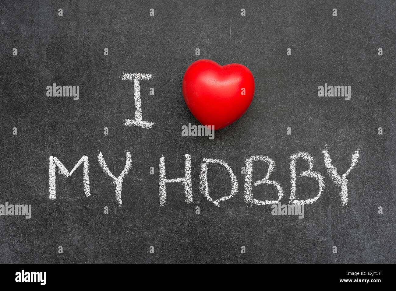 love my hobby phrase handwritten on blackboard with heart symbol