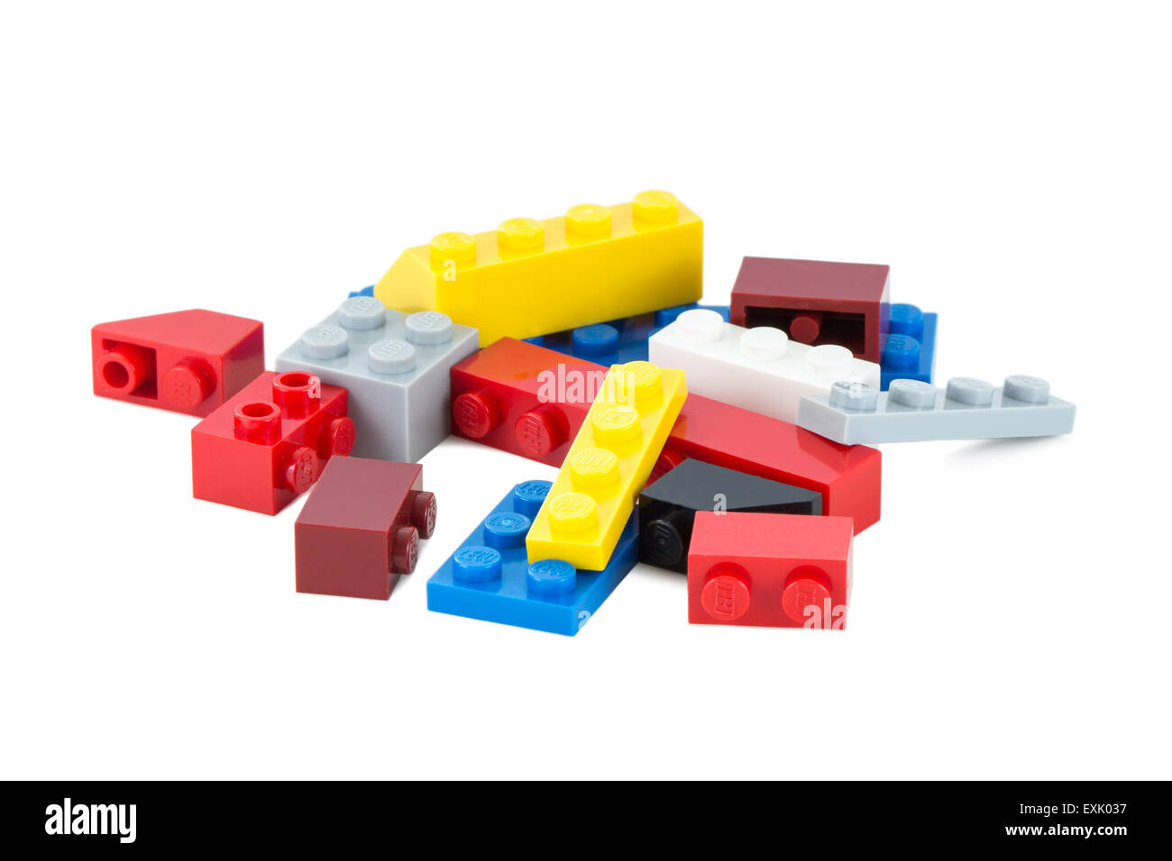Closeup of pile of colorful Lego pieces isolated on white background