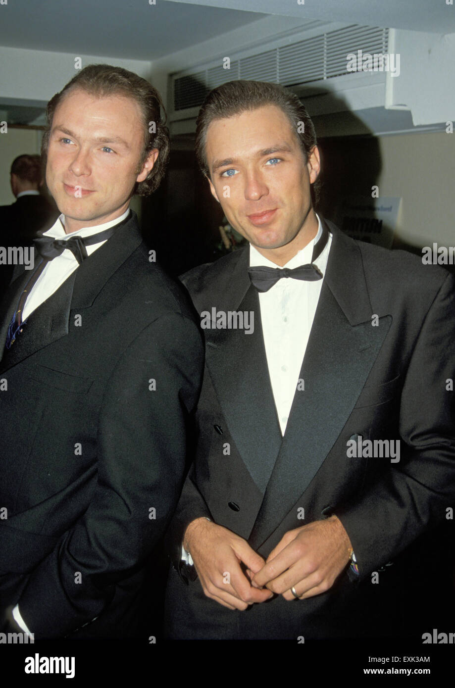 GARY KEMP (at left ) and brother Martin in 1990 at premiere of film The Krays Stock Photo