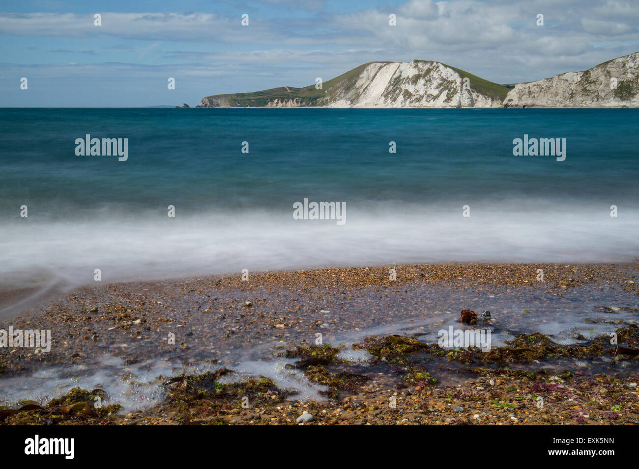 Worbarrow Bay With White Cliffs And Waves On Shingle Beach Stock Photo 